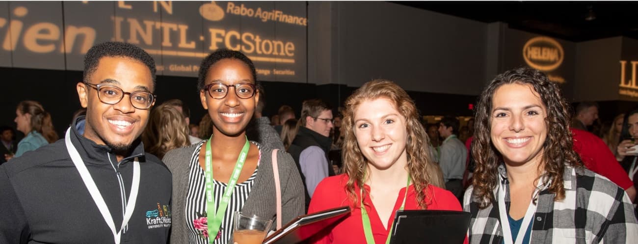 Students smiling at conference