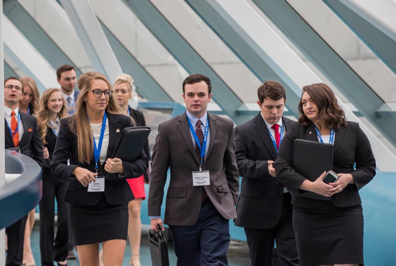 Students walking with folios